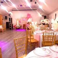 Boston Studio Rental - Sweet 16 party setup with throne chair, floral wall, Chiavari chairs, and balloon decor.