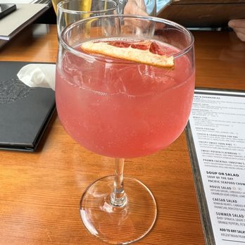 The Surly Mermaid - The New Girl Next Door:  Empress Elderflower and Rose gin, passion fruit tea syrup, lemon, finished with Rosé bubbles. - Seafood Near Me - Sidney, British Columbia
