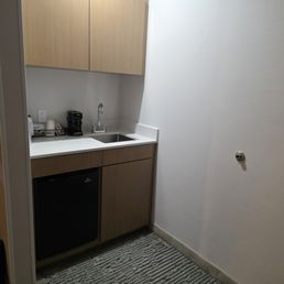 kitchenette, refrigerator, coffee maker, sink and microwave in the cabinet kitchenette, refrigerator, coffee maker, sink and microwave in the cabinet