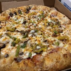 Parm stuffed crust with extra cheese, beef, green pepper, banana pepper, jalapeños, onions, and cheddar cheese,