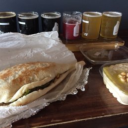 a sandwich with a side of dips a sandwich with a side of dips