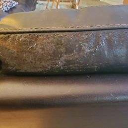 This is some of the flaking. On the top edge of the couch, where nobody touches or sits This is some of the flaking. On the top edge of the couch, where nobody touches or sits