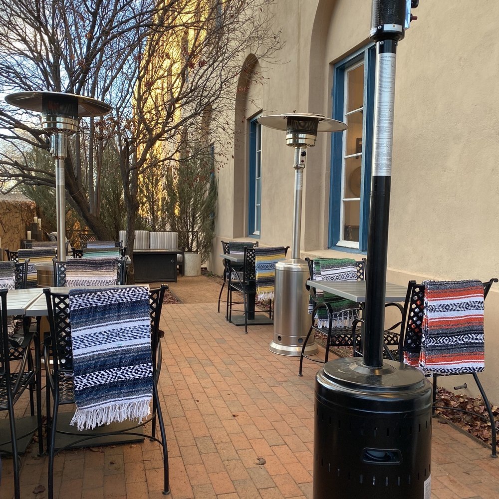 Gruet Winery - Santa Fe - Outside seating with heat lamps and blankets - Wine Tasting Room Near Me - Santa Fe, New Mexico Gruet Winery - Santa Fe - Outside seating with heat lamps and blankets - Wine Tasting Room Near Me - Santa Fe, New Mexico