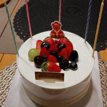 Tous Les Jours - a birthday cake with fruit and candles - Bakeries Near Me - Burlington, Massachusetts Tous Les Jours - a birthday cake with fruit and candles - Bakeries Near Me - Burlington, Massachusetts