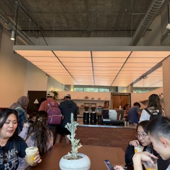 Kasama Cà Phê - Large table for communal sitting - Coffee & Tea Near Me - San Jose, California Kasama Cà Phê - Large table for communal sitting - Coffee & Tea Near Me - San Jose, California