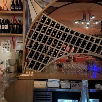 Moonflower - a bar with wine bottles and wine glasses - Wine Bars Near Me - New York, New York Moonflower - a bar with wine bottles and wine glasses - Wine Bars Near Me - New York, New York