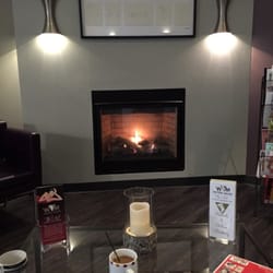 WM DaySpa Salon - Waiting area with fireplace.