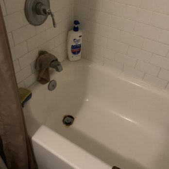Metropolitan Bath and Tile - Bathtub with rusted out area near drain - General Contractors Near Me - Bowie, Maryland
