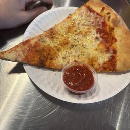 Cheese pizza and spicy marinara on the side Cheese pizza and spicy marinara on the side
