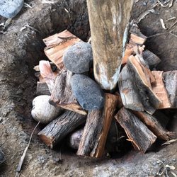 Learn about cooking in an underground pit