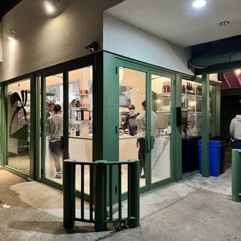 Palm Pizza - the outside of a restaurant at night - Pizza Near Me - Austin, Texas