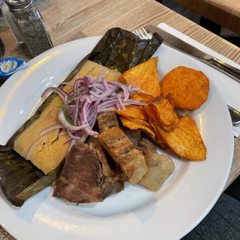 Chicha Peruvian Kitchen - Tamal, chicharrones, sweet potatoes, and a salsa. So good! - Peruvian Near Me - Roseville, California Chicha Peruvian Kitchen - Tamal, chicharrones, sweet potatoes, and a salsa. So good! - Peruvian Near Me - Roseville, California