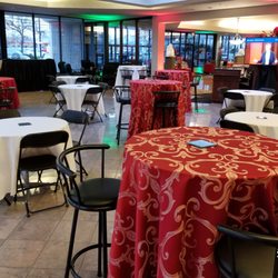 Sportsplex Rentals - Corporate Holiday Party. Rentals included tables, chairs, bar stools, linens, red carpet, uplighting, tvs, chafing dishes, convection oven.