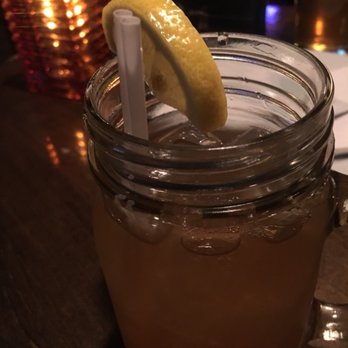 Typhoon Lounge - a drink in a mason jar with a slice of lemon - Lounges Near Me - Montreal, Quebec