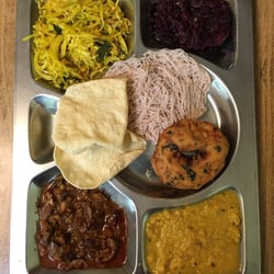 Janani Restaurant - Vegetarian thali with dal, beetroot, aubergine, cabbage, papadum, string hoppers and vada.