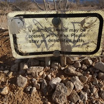 Seven Magic Mountains - Signs to warn you about venomous snakes. Make smart choices out here in our desert as the nearest hospital is 25 minutes away. - Public Art Near Me - Las Vegas, Nevada