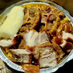 Collado Restaurant - My take home large container - yellow rice, with yuca, crispy pork, ox tail - yummy! About $25