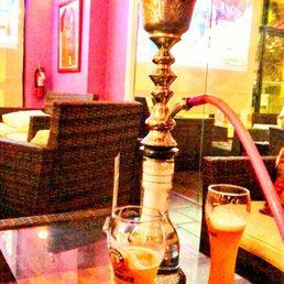 a hookah and a glass of beer