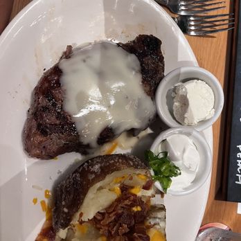 BJ's Restaurant & Brewhouse - BJ's Classic Rib-Eye* with baked potato - New American Near Me - Live Oak, Texas BJ's Restaurant & Brewhouse - BJ's Classic Rib-Eye* with baked potato - New American Near Me - Live Oak, Texas