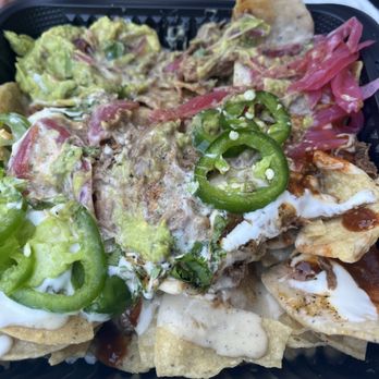 Lloyd Taco Factory - Tricked Out Nachos with braised beef - Tacos Near Me - Williamsville, New York Lloyd Taco Factory - Tricked Out Nachos with braised beef - Tacos Near Me - Williamsville, New York