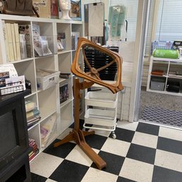 Hand quilting stand ant a great price.   Behind that is many cross-stitch kits.
