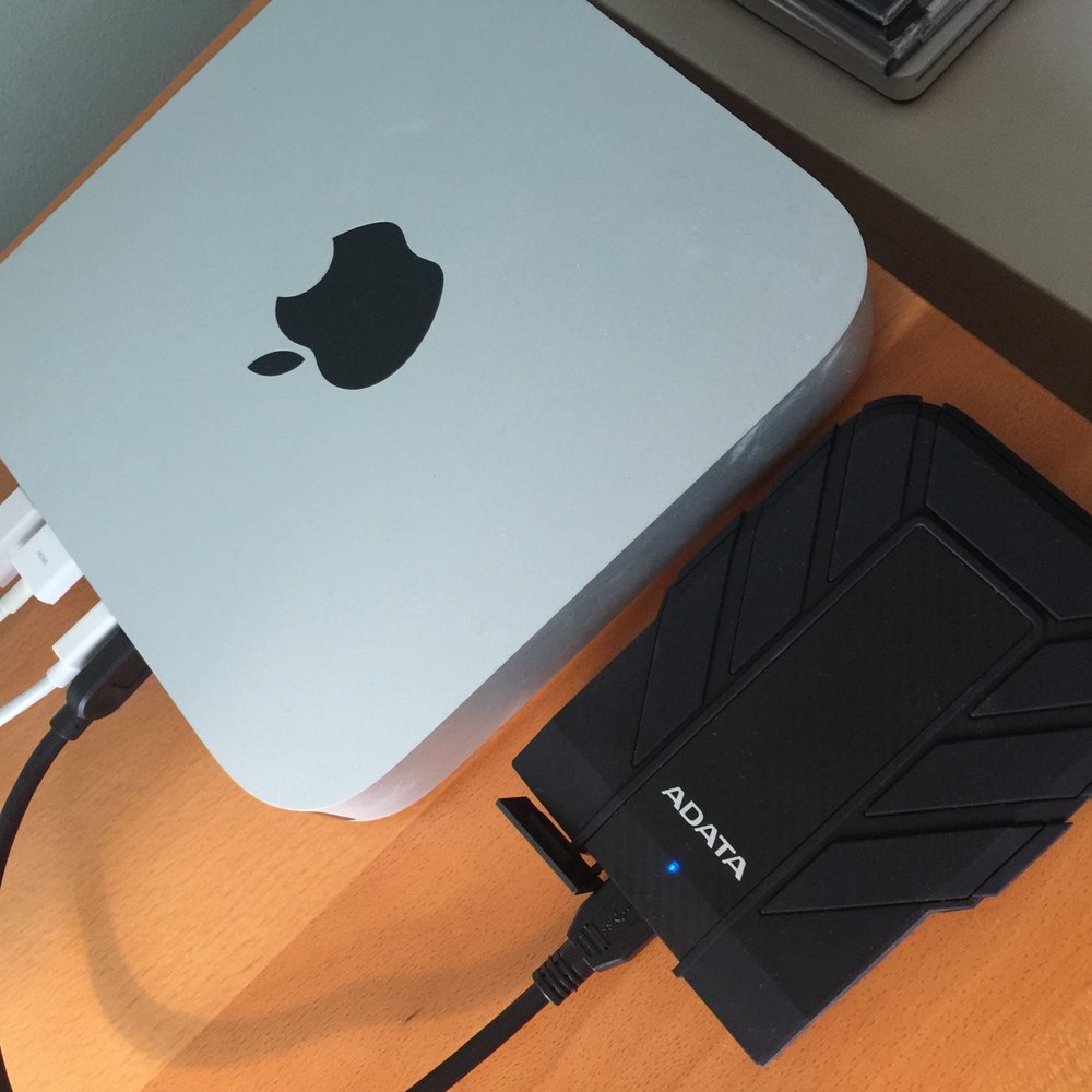 My refurbished Mac Mini with a new SSD drive and a new external backup drive: Adata. Very cost efficient.  A really smart solution.