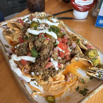 Carlisle's - Nachos with seasoned beef - Gastropubs Near Me - Muskegon, Michigan Carlisle's - Nachos with seasoned beef - Gastropubs Near Me - Muskegon, Michigan