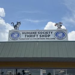 This is a picture of the sign above Molly Mutts II Thrift Store that is run by the Humane Society.