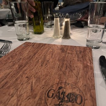 Gallo Ristorante - a table setting with a cutting board and utensils - Italian Near Me - Ridgefield, Connecticut Gallo Ristorante - a table setting with a cutting board and utensils - Italian Near Me - Ridgefield, Connecticut