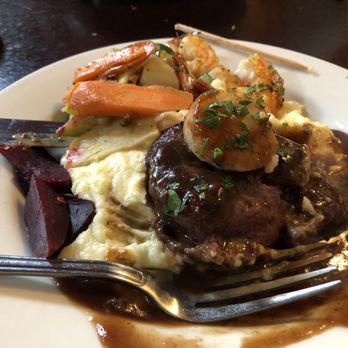The Rendezvous Grill - Beef fillet large scallop and three large shrimp with mashed potatoes and fresh vegetables. - New American Near Me - Welches, Oregon