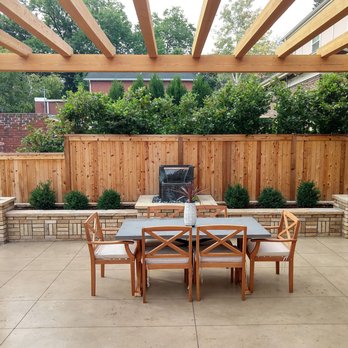 Sundial Designs - A dining space with style featuring a concrete patio, pergola, water feature. - Landscape Architects or Designers Near Me Sundial Designs - A dining space with style featuring a concrete patio, pergola, water feature. - Landscape Architects or Designers Near Me