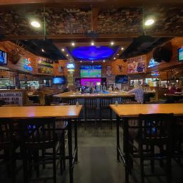 In the center is the large bar. There are large seating areas for diners on 3 sides of the bar. In the center is the large bar. There are large seating areas for diners on 3 sides of the bar.