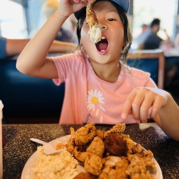 Lone Cabbage Fish Camp - She's enjoying the frog legs - Seafood Near Me - Cocoa, Florida