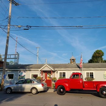 Huckleberry Cafe - a red truck and a silver car - Barbeque Near Me - Lacona, New York Huckleberry Cafe - a red truck and a silver car - Barbeque Near Me - Lacona, New York
