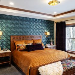Timeless Craftsman home transformed with jewel tones, custom details, and refined materials for elegant, comfortable living.