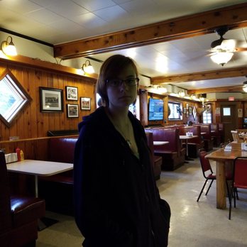 Tavern On Central - a woman standing in a restaurant - Bars Near Me - Florence, Wisconsin