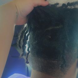 Palm Harbor Barber Shop - As you can see by the CHUNKS of hair longed than the rest, as well as a straight line across the bottom near his nape???
