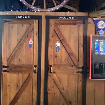 Beers To You Saloon - two wooden doors and a beer machine - Dive Bars Near Me - Weston, Missouri