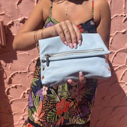 Katalina’s Boutique - Angie smocked dress with the Hazy Blue VIP HAMMITT purse against the colorful Venetians!