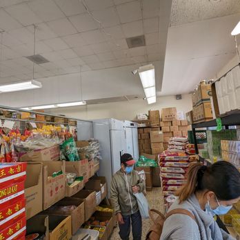 New Wing Lung Food - two people in a grocery store - Specialty Food Near Me - San Francisco, California New Wing Lung Food - two people in a grocery store - Specialty Food Near Me - San Francisco, California