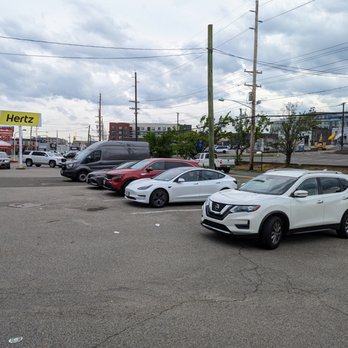 Hertz Rent A Car - Parking lot of cars shortly before closing. - Car Rental Near Me - Hackensack, New Jersey Hertz Rent A Car - Parking lot of cars shortly before closing. - Car Rental Near Me - Hackensack, New Jersey