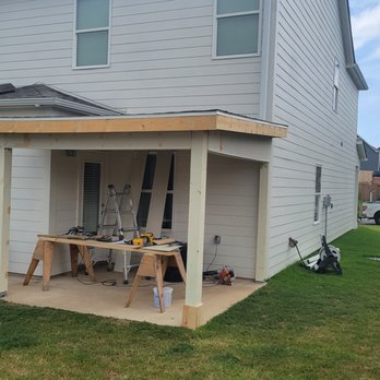 David Taylor Construction - the back of a house with a workbench - General Contractors Near Me