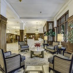 Pacific Grove Senior Living - Common area with four arm chairs around a round table