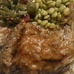 Claudie B's Restaurant - Baked smothered chicken, white rice Lima beans , ok rand stewed tomatoes- Part of the daily special.