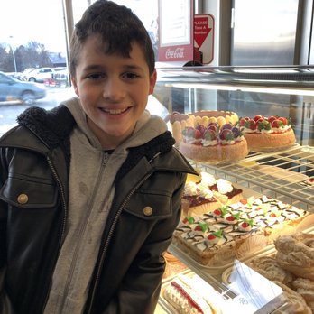 Colarusso's Bakery - a boy in front of a display case of pastries - Bakeries Near Me - Stoneham, Massachusetts Colarusso's Bakery - a boy in front of a display case of pastries - Bakeries Near Me - Stoneham, Massachusetts