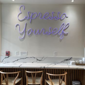 Gourmet Central Bakery - a counter with chairs and a neon sign - Coffee & Tea Near Me - Prunedale, California Gourmet Central Bakery - a counter with chairs and a neon sign - Coffee & Tea Near Me - Prunedale, California