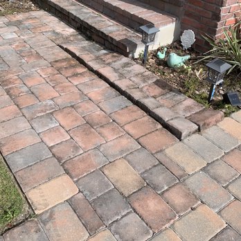 Matao pavers services  - Before photo with three years of uninstalled pavers and unsealed driveway and porch. - Landscaping Near Me - Orlando, Florida