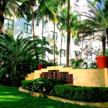 Helen Mar Apts - Part of the manicured curb. There is a garden inside that has lawn chairs, pool, a stone table and benches, and tiling. - Apartments Near Me - Miami Beach, Florida Helen Mar Apts - Part of the manicured curb. There is a garden inside that has lawn chairs, pool, a stone table and benches, and tiling. - Apartments Near Me - Miami Beach, Florida