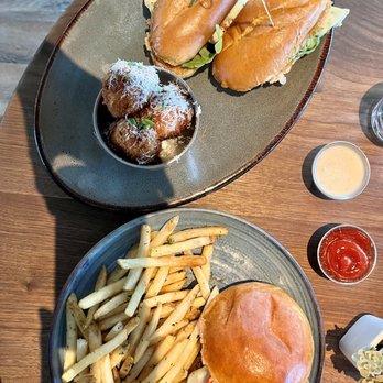Eureka - Top: Napa Chicken Sandwich with mac n cheese balls. Bottom: Bison burger with fries - American Near Me - Santa Clara, California Eureka - Top: Napa Chicken Sandwich with mac n cheese balls. Bottom: Bison burger with fries - American Near Me - Santa Clara, California