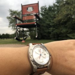 World's Second Largest Rocking Chair - Mother Road Collection of Sangamon Watches in front of the largest rocking chair in Fanning Missouri